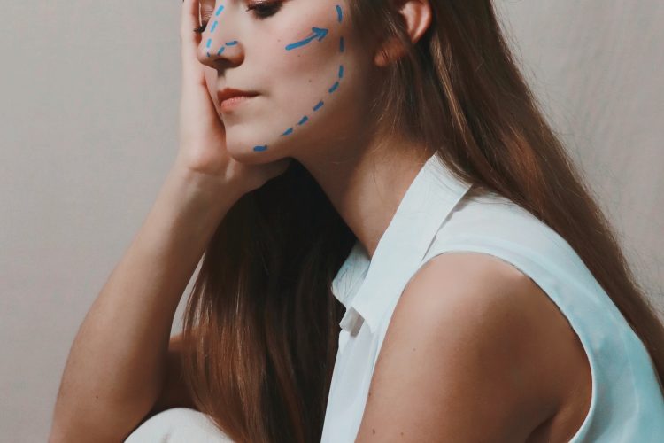 woman with plastic surgery lines on her face